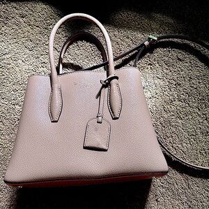 Light pink Kate spade purse with adjustable strap